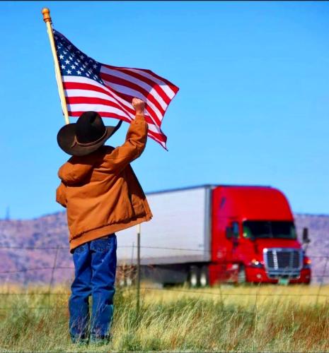 !     Young Patriot waving to Trucker